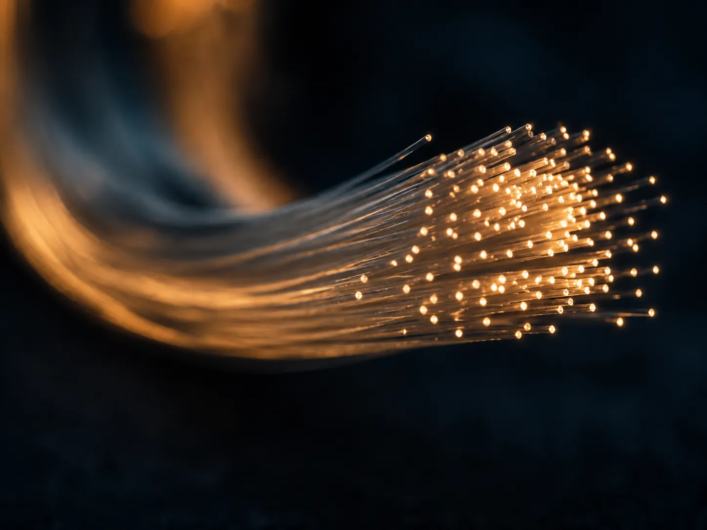 Fiber optic cables glowing with light
